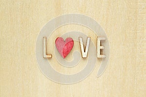 Wooden letters spelling out Love with a red heart