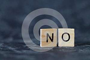 Wooden letters spelling out the word NO