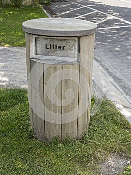 The wooden litter bin