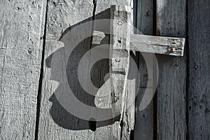 Wooden lock and shadow in head face