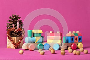 Wooden Locomotion on pink backdrop