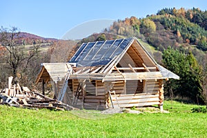 Wooden log house under construction. Highlander architecture