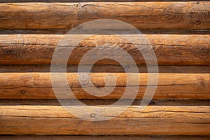 Wooden log house wall texture background, closeup view.