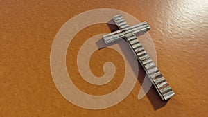 Wooden logg  cross on an clay background. 3d illustration metaphor for God, Christ, Christianity