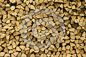 Wooden logs, beams, firewood, frame. A lot of wood. Wooden log wooden background. Fuel. Harvesting firewood for the