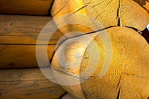 Wooden logs blockhouse with sunbeam closeup background