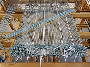 Wooden loom tools on a weaving loom