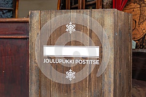 A wooden mailbox for joulupukki - skandinavian santa claus, children writes letters with their wishes to him before christmas
