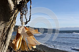 Wooden Mala Beads and Ocean Background