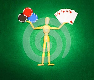 Wooden man with hands up to hold chips and cards for playing poker