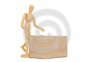 Wooden man next to a cardboard box isolates