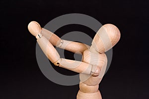 A wooden mannequin gesticulate