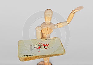 Wooden mannequin with playing cards