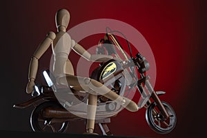 Wooden mannequin on wooden Motorcycle