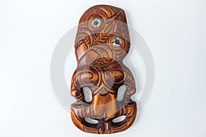 Wooden Maori Hei Tiki hand carved with paua shell eyes. New Zealand taonga.