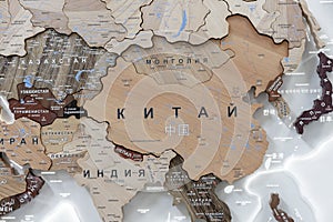 Wooden map of China and neighboring countries, names of countries in Russian. Map for trip planning