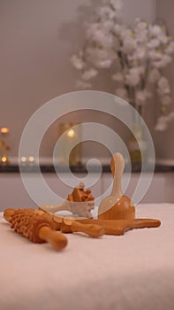 Wooden massage tools, madero therapy materials on spa salon table, anti cellulite concept