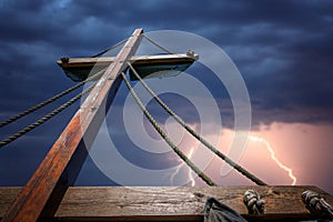 Wooden mast of a pirate ship during storm