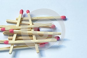 Wooden match sticks stacked one upon the other