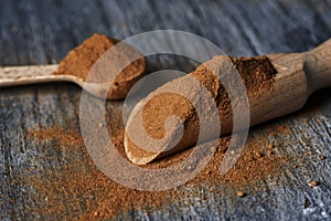 Wooden spoons full of camu-camu powder photo