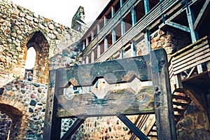 Wooden medieval torture device, ancient pillory in castle.