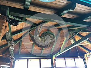 Wooden-metal roof constriction and decorative hanging pot