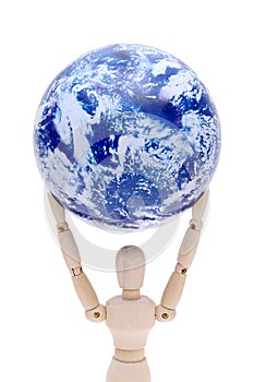 Wooden model dummy holding globe over head