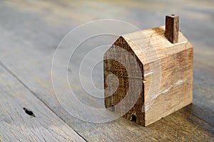 Wooden model house on table