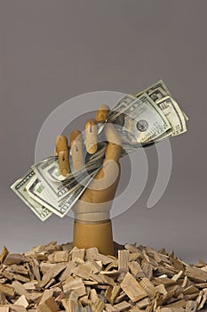 Wooden Modeling Hand Holding Cash