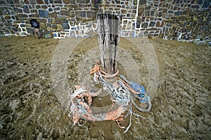 Wooden mooring post in old harbour