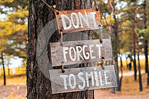 A wooden motivating sign - Donâ€™t forget to smile