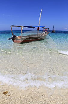 Wooden motor boat on ocean water surface