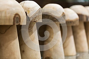 Wooden mushrooms standing in a line