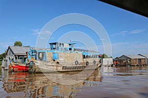 wooden nautical vessel in water village on mekong delta