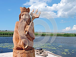 Wooden Neptune statue