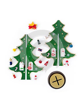 Wooden New Year`s, Christmas tree, with small toys, decorations, balls, a disassembled souvenir on white background.