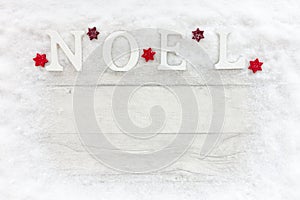 Wooden Noel Letters on Snow and White Wood Christmas Background