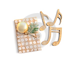 Wooden notes and gift box on white background.