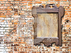 Wooden notice board against a brick wall background - image with copy space