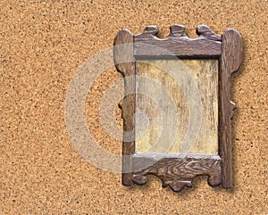 Wooden notice board against a cork background