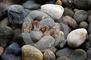 Wooden number 2021 on stones background