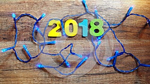 Wooden numbers forming the number 2018, For the new year 2018 on a wooden background