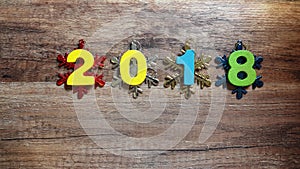 Wooden numbers forming the number 2018, For the new year 2018 on a wooden background