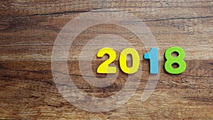 Wooden numbers forming the number 2018, For the new year 2018 on a wooden background