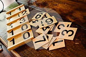 Wooden numbers in tables to learn mathematics in a Montessori classroom