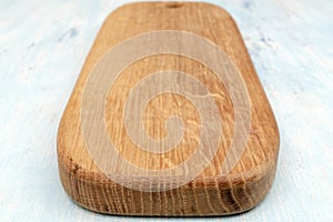 Wooden oak cutting board. Kitchenware. Copy space