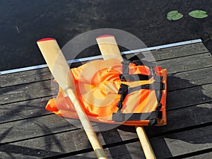 Wooden oars and life jacket
