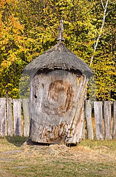 Wooden old ancient beehive, made from a tree trunk