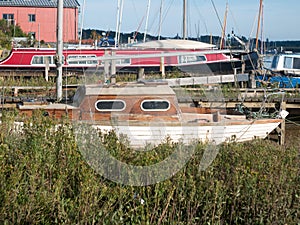 Wooden old boat moored in small town dock