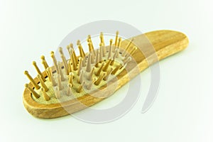 Wooden old comb with hair isolated